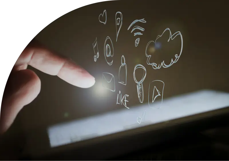Fingers interacting with floating digital icons on a touchscreen, representing communication and technology.