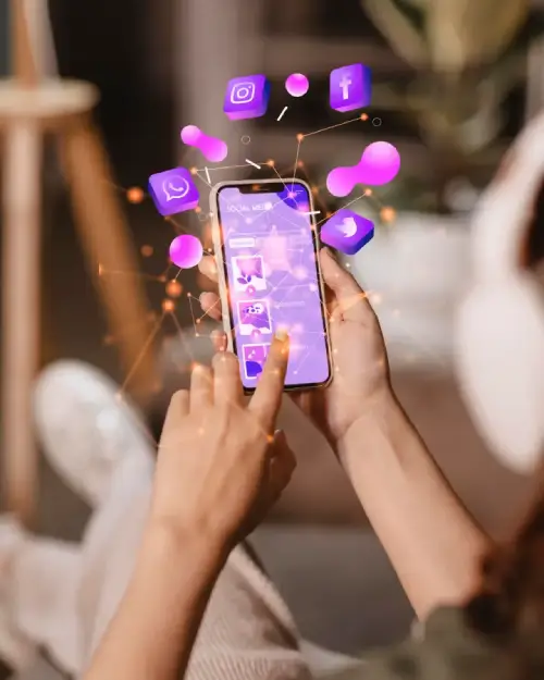 Person using a smartphone with social media icons floating above in a digital network concept.